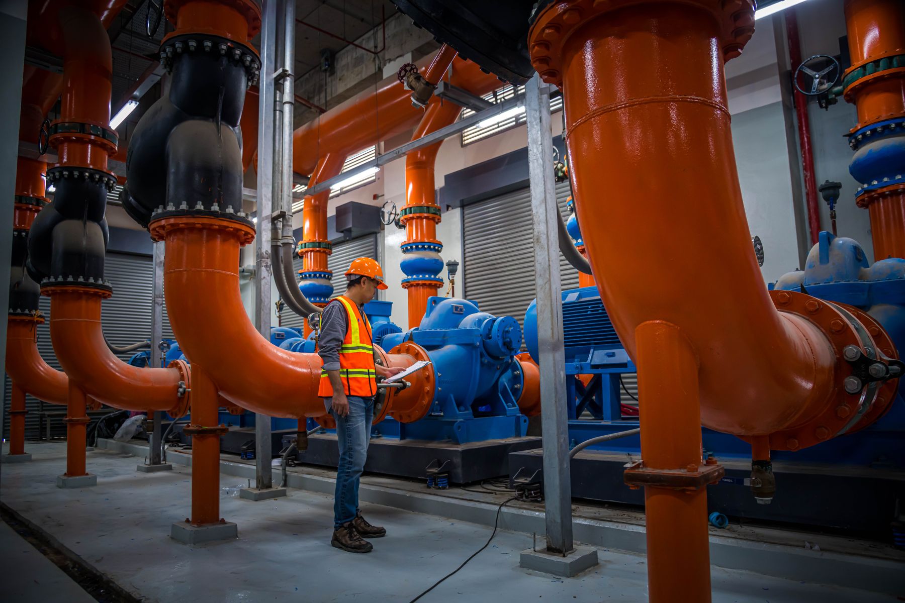 Specialist inspecting a chilled water plant